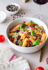 Pasta alla Norma with eggplant, tomatoes, cheese and basil. Italian food. Vegetarian food.