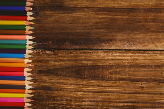 Color pencils on wooden table
