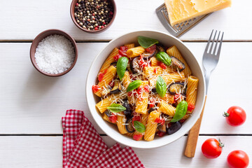 Pasta alla Norma with eggplant, tomatoes, cheese and basil. Italian food. Vegetarian food.