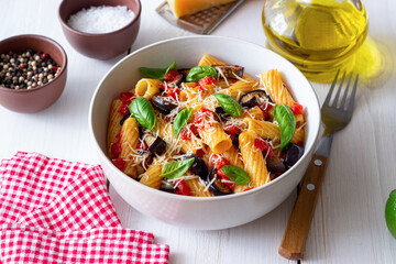 Pasta alla Norma with eggplant, tomatoes, cheese and basil. Italian food. Vegetarian food.