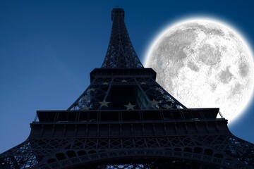 Naklejka premium Large moon over Eiffel tower