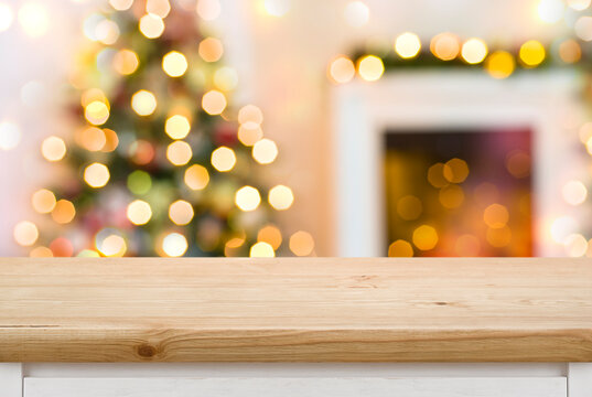 Empty Table In Front Of Christmas Tree And Fireplace Decorations