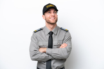 Young safeguard caucasian man isolated on white background looking up while smiling