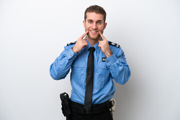 Young police caucasian man isolated on white background smiling with a happy and pleasant expression