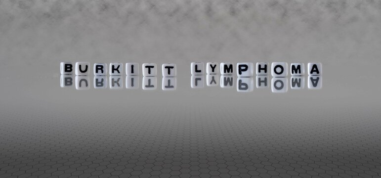 Burkitt Lymphoma Word Or Concept Represented By Black And White Letter Cubes On A Grey Horizon Background Stretching To Infinity