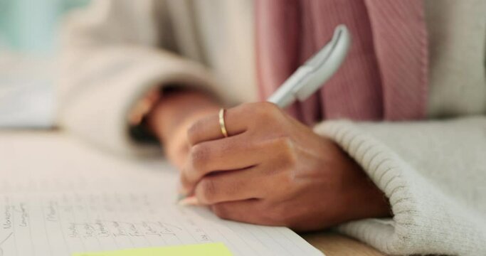 Woman writing notes, to do list and journal diary book for budget planning, pen to sign and write application at home, library and university. Student hands, homework assignment and research learning