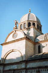 Fototapeta na wymiar Particulars of The Cathedral of St. James against blue sky. Sibenik, Croatia