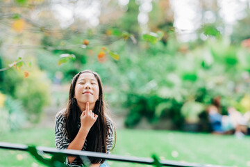 woman reading a book in the park