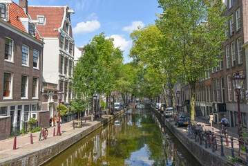 Fototapeta na wymiar Amsterdam, Netherlands. August 2022. View of one of the canals in Amsterdam.