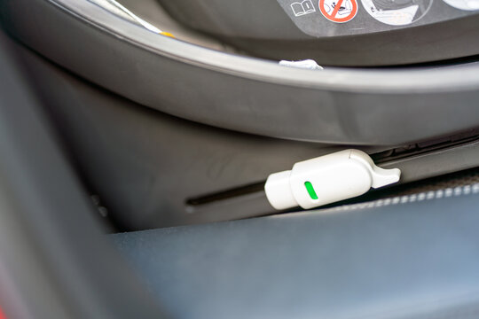 Isofix connection standard to fasten childrens carseat to car interior. Safety and transport concept.