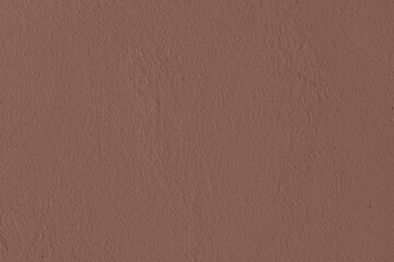 Saturated dark brown colored low contrast Concrete textured background. Empty colorful wall texture with copy space for text overlay and mockups. 2023, 2024 color trend