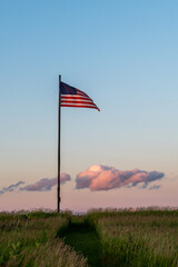American flag against an evening sky, dusk, sunset,  in Minnesota, USA
