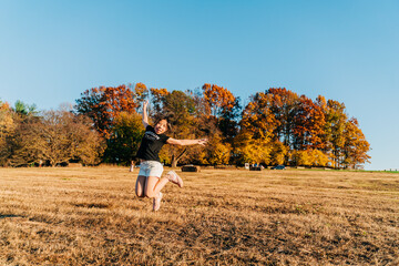 child running in autumn park