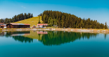 Beautiful alpine summer view with reflections in a lake at the famous Astberg summit, Going, Wilder Kaiser, Tyrol, Austria