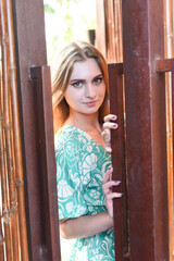 Portrait of beautiful Belarusian woman half Ukrainian in pink dress