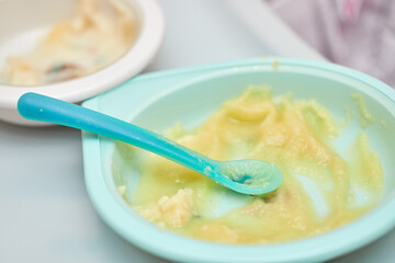 Bowl with vegetable puree for baby on table