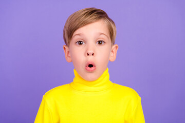 Photo of impressed school person pouted lips stare speechless cant believe isolated on violet color...
