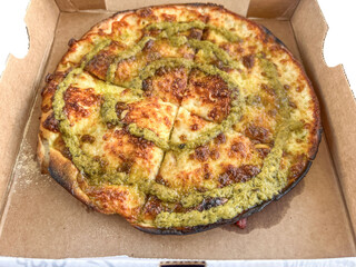 italian margarita pizza in a carton box to delivery