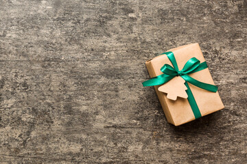 wrapped christmas or other holiday handmade present in paper with colored ribbon. Present box,...