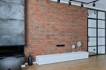 modern living room with fireplace and bricked wall