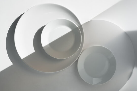 dishes for a cafe and restaurant on a light background of different sizes. Preparing for table setting