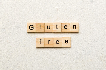 gluten free word written on wood block. gluten free text on table, concept - obrazy, fototapety, plakaty