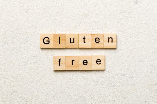 gluten free word written on wood block. gluten free text on table, concept