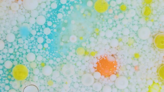 Floating colorful acrylic paint bubbles background
