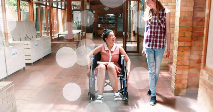 Animation of light spots over disabled biracial student with friend
