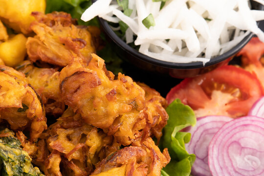 Indian Tea Time Snacks Fritters Onion Pakoda Also Called Pyaz Ke Pakore, Kanda Bhajji, Pyaj Bajji, Pyaaz Bhaji Or Pyaaj Pakora Is Deep Fried Street Food Enjoyed Across North And South India