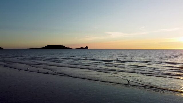 Aerial view Rhossili Bay beach located in the Gower Swansea at sunset