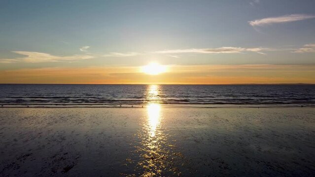 Aerial view of Rhossili Bay beach located in the Gower Swansea at sunset