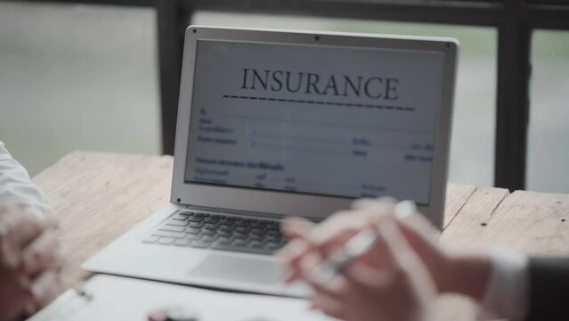 The insurance agent is explaining the insurance coverage and benefits that the customer can get.