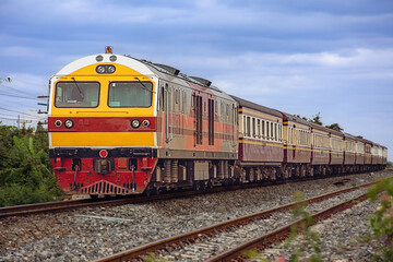 Fototapeta na wymiar Passenger train by diesel locomotive on the railway 