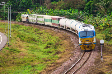 Fototapeta premium Tanker-freight train by diesel locomotive on the railway
