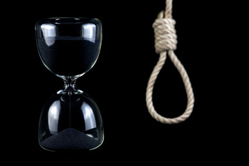 Hourglass with Out of Focus Hangmans Noose in Background