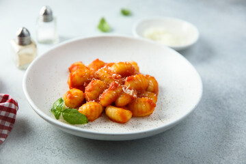 Traditional homemade potato gnocchi with tomato sauce