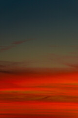 Cover page with gradient soft deep orange sky, illuminated clouds at bloody sunset as a background.