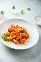 Traditional homemade potato gnocchi with tomato sauce