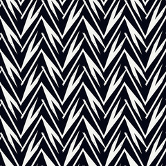 Ethnic seamless pattern. Freehand zigzag stripes print. Boho chic design background. Tribal style wallpaper. Brush wavy lines. Handdrawn geometric ornament. Chevron backdrop. Indigenous image.