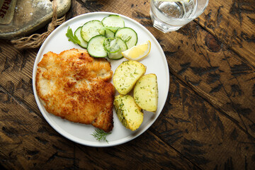 Traditional homemade schnitzel with potatoes