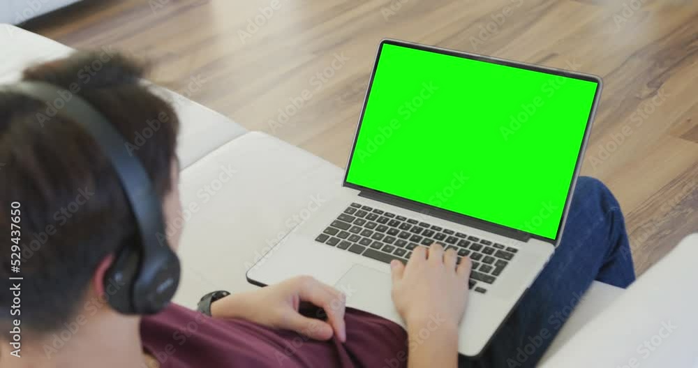 Wall mural Animation of asian boy having online lessons on laptop with copy space