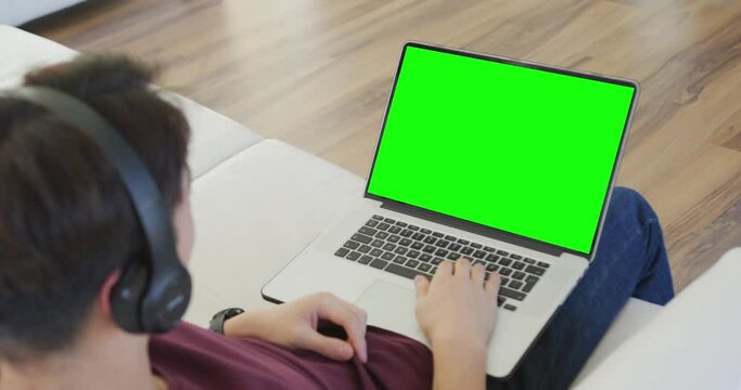 Animation of asian boy having online lessons on laptop with copy space