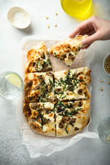 Homemade mushroom pizza with roasted arugula