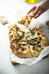 Homemade mushroom pizza with roasted arugula