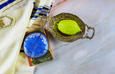 Sukkot is a Jewish holiday celebrated in autumn the traditional symbols associated with it are the...