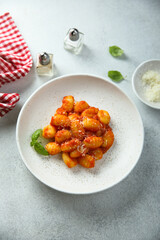 Traditional homemade potato gnocchi with tomato sauce