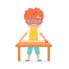 Woodwork of funny child, boy in goggles holding ruler in hands to measure work bench