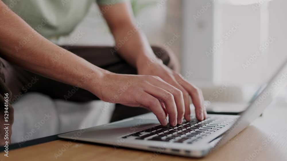 Aufkleber freelancer hands typing on a laptop with a remote job working in his living room. closeup of a creat