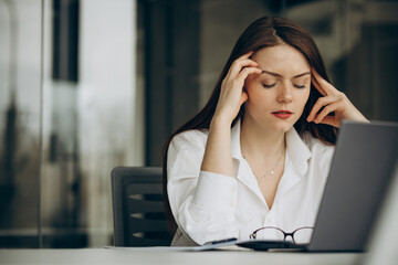 Woman working in office on a computer